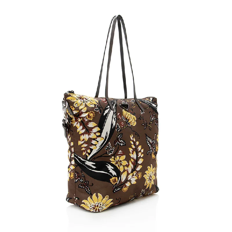 Prada Cahier bags featuring the signature triangular logo plaquePrada Floral Tessuto Tote 17540