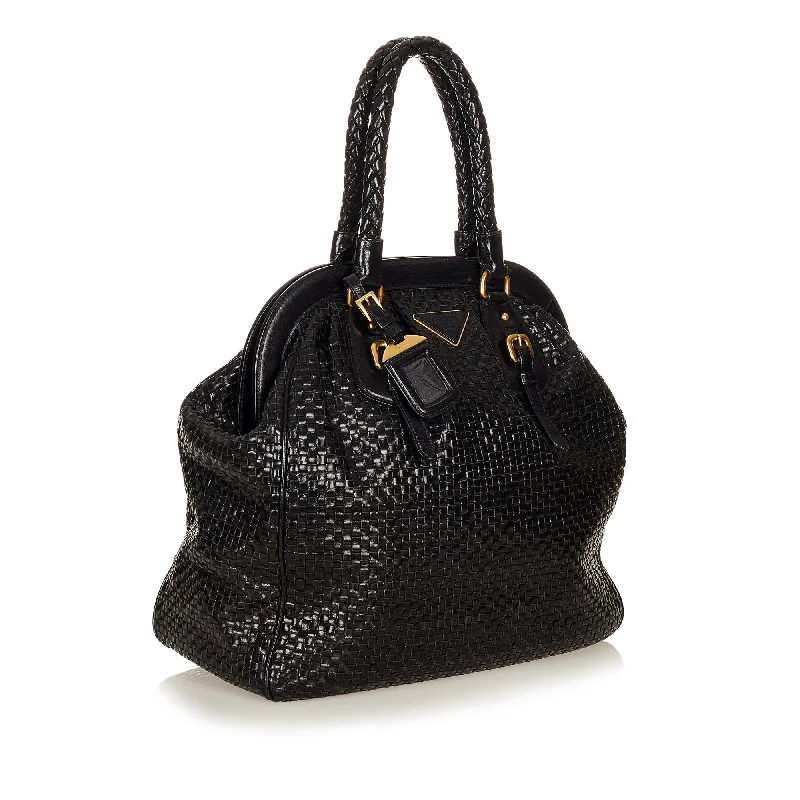 Prada Cleo bags with a contrast - colored interior for visual interestPrada Frame Woven Leather Tote Bag 26909