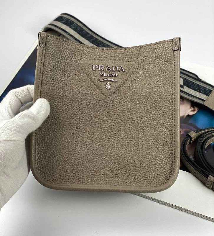 Ladies Prada Re - Edizione 2005 bags in a pastel color for a soft lookPrada Leather mini shoulder bag clay gray