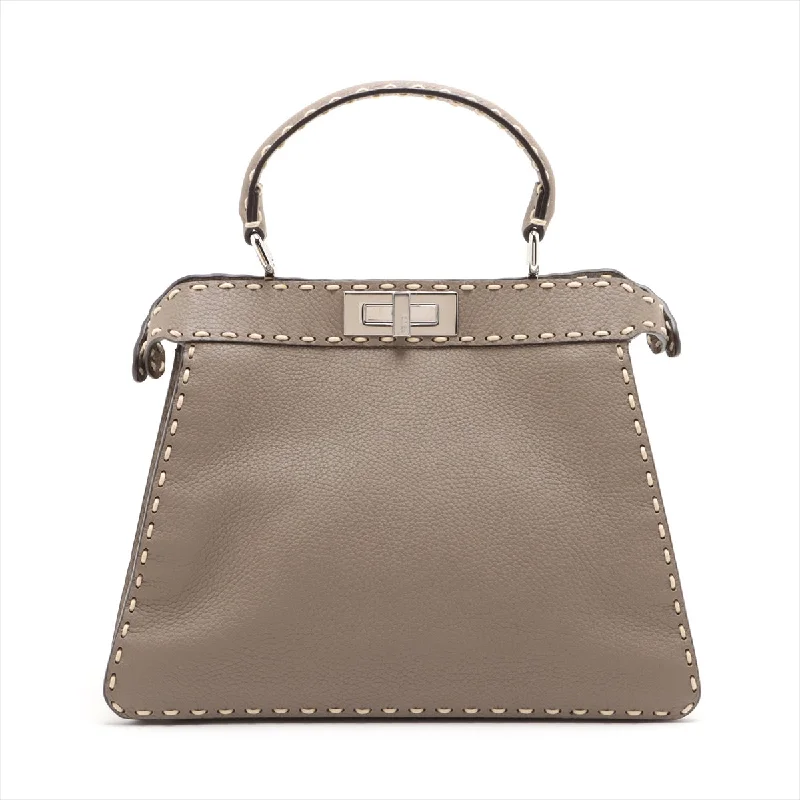 Fendi Baguette bags with a studded leather trim for a bold and edgy lookFendi Peekaboo I See You Handbag Taupe Leather 2WAY 8BN321