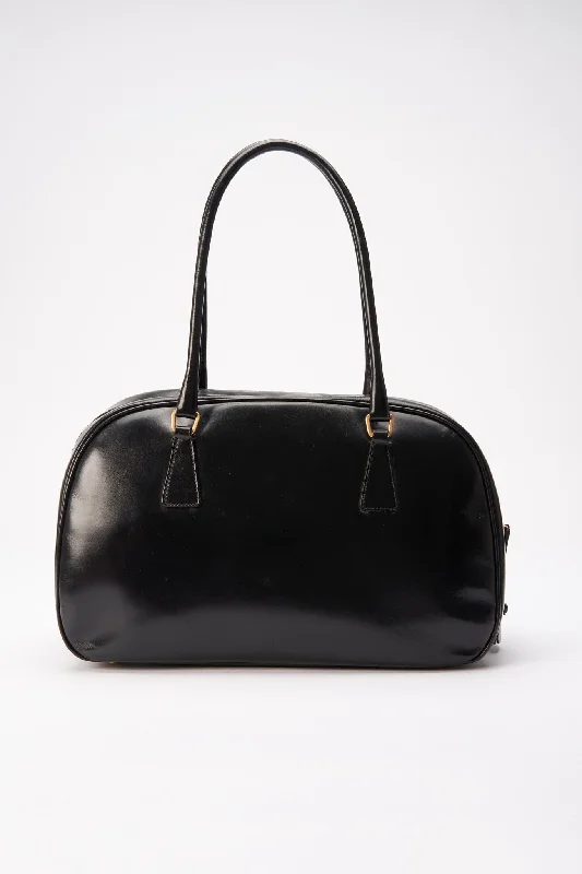 Prada Cahier bags with a detachable shoulder strap for versatile carryingA vintage 90's Prada Black Leather Shoulder Bag