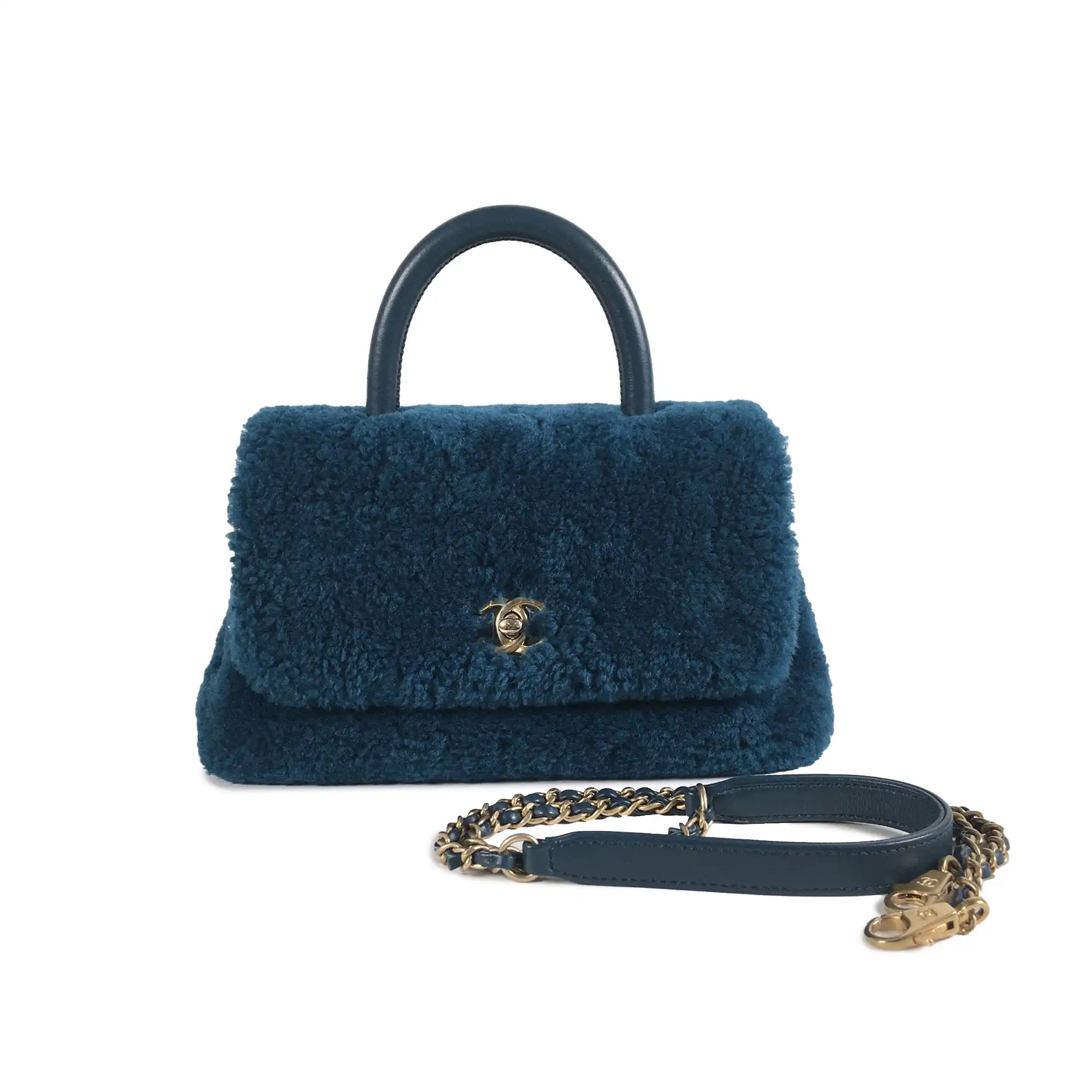 Chanel bags with exclusive seasonal releasesChanel Coco Top Handle Small Blue Shearling Gold