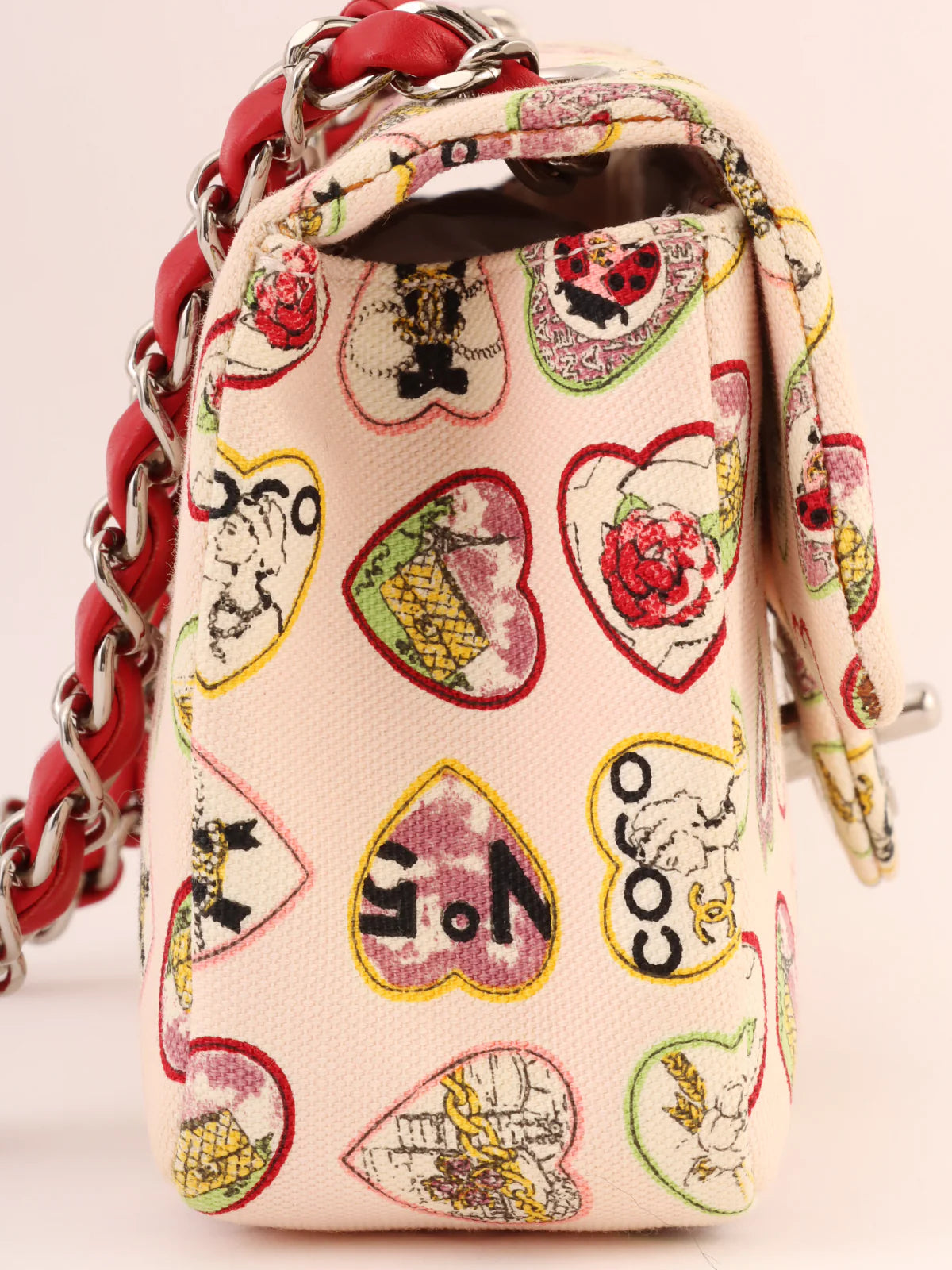 Chanel bags with iconic stitching detailsCHANEL Around 2005 Made Valentine Icon Pattern Turn-Lock Chain Bag Baby Pink/Multi