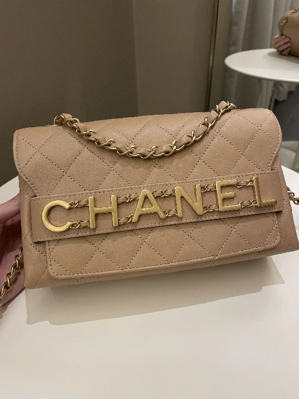 Chanel bags with gold, silver, and pearl accentsChanel C H A N E L Lettering Flap Dark Beige Calfskin