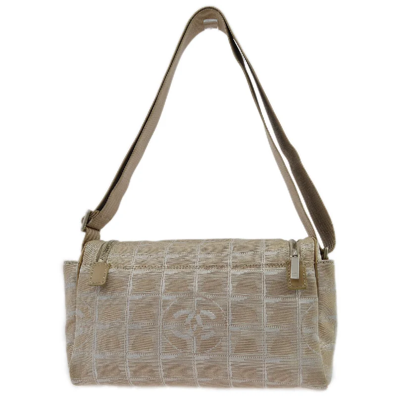 Chanel bags with gold, silver, and pearl accentsChanel Beige Jacquard Nylon Travel Line Shoulder Bag